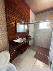 a bathroom with a sink and a toilet at BETEL Hospedagem in Penha