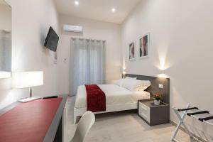 A bed or beds in a room at La Torre 31