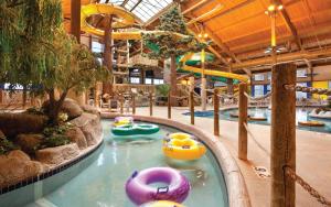 a indoor water park with slides and inflatable boats at Holiday Inn Club Vacations at Lake Geneva Resort, an IHG Hotel in Lake Geneva
