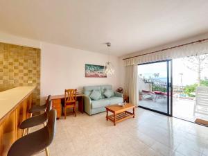 a living room with a couch and a table at Calle Tamara 2-9 in Santiago del Teide