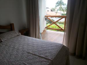 Postel nebo postele na pokoji v ubytování Paraíso dos Corais