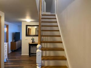 a staircase in a home with a stair case at Myrarkot Country Home in Selfoss