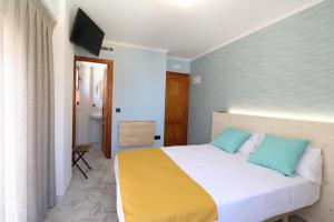 Łóżko lub łóżka w pokoju w obiekcie 205 I Posada del Mar I Encantador hostel en la playa de Gandia