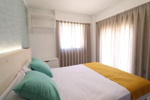 Łóżko lub łóżka w pokoju w obiekcie 205 I Posada del Mar I Encantador hostel en la playa de Gandia