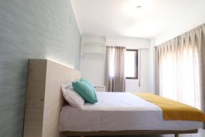 Łóżko lub łóżka w pokoju w obiekcie 205 I Posada del Mar I Encantador hostel en la playa de Gandia