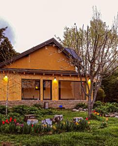 a house with flowers in front of it at Nómada in San Martín de los Andes