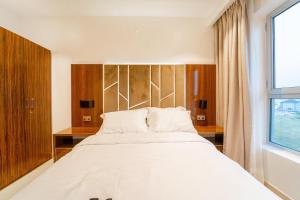 Rúm í herbergi á OCEANVIEW 2Bedroom SMARTHOME WITH POOL