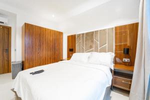 Rúm í herbergi á OCEANVIEW 2Bedroom SMARTHOME WITH POOL