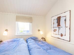 Katil atau katil-katil dalam bilik di Holiday home Frederikshavn XIV