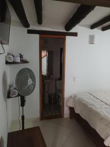 A bed or beds in a room at Cemandy Hostal