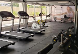a gym with several exercise bikes in a room at Flat beira mar do Cabo Branco in João Pessoa