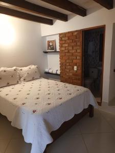 A bed or beds in a room at Cemandy Hostal