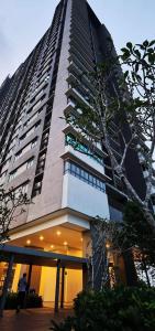 a tall building with a lot of windows at Oasisstay 4 Bedrooms Apartment With Studio at Bangi Sentral in Bandar Baru Bangi