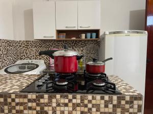 Een keuken of kitchenette bij Studio a 100m da praia - VILA PAITITÍ