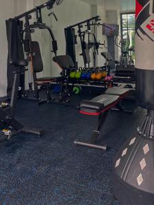 a gym with a bunch of exercise equipment in it at Chaweng Residence in Koh Samui 