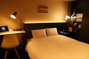 Postel nebo postele na pokoji v ubytování Nplus HOTEL Higashikanda-akihabara