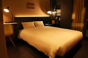 Postel nebo postele na pokoji v ubytování Nplus HOTEL Higashikanda-akihabara
