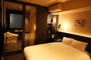Postel nebo postele na pokoji v ubytování Nplus HOTEL Higashikanda-akihabara