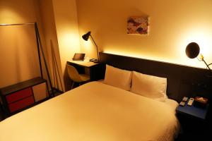 Postel nebo postele na pokoji v ubytování Nplus HOTEL Higashikanda-akihabara