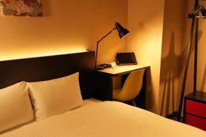 Postel nebo postele na pokoji v ubytování Nplus HOTEL Higashikanda-akihabara