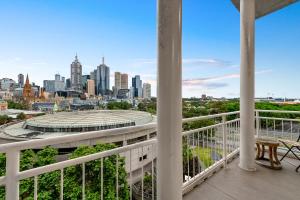a balcony with a view of the philadelphia skyline at Exclusive Stays - Southgate in Melbourne