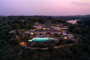 an aerial view of a large mansion with a swimming pool at Chunda Shikar Oudi in Udaipur