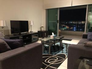 A seating area at High Above, Pandanas Darwin 21st floor with views