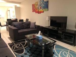 A television and/or entertainment centre at High Above, Pandanas Darwin 21st floor with views