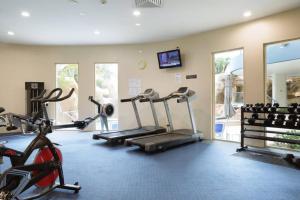 a gym with several exercise bikes in a room at Gem in the Heart of Mooloolaba - Landmark Resort in Mooloolaba