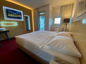 Letto o letti in una camera di HABAKUK Wellness & Event Hotel