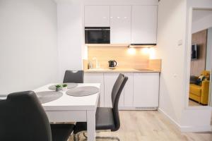 Kuchyňa alebo kuchynka v ubytovaní Apartamenty City Center - Zdrojowe