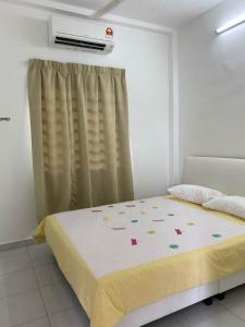 Postel nebo postele na pokoji v ubytování 15 min to Qing Xin Ling Cultural Village Ipoh