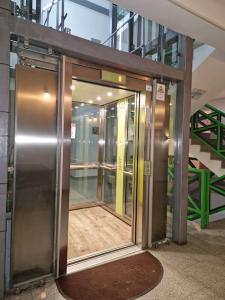 an entrance to a building with a revolving door at Studio modern. in Bucharest