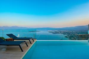 a swimming pool with a view of the water at Majestic View Villas in Agios Nikolaos