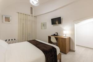 A bed or beds in a room at La Torre 31
