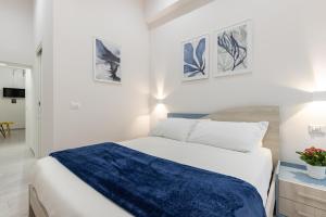 A bed or beds in a room at La Torre 31