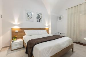 A bed or beds in a room at La Torre 31