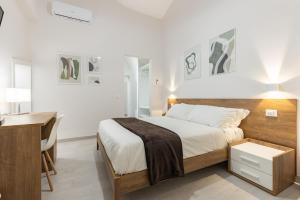 A bed or beds in a room at La Torre 31