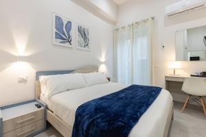 A bed or beds in a room at La Torre 31