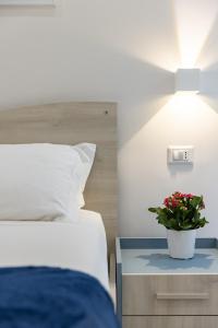A bed or beds in a room at La Torre 31