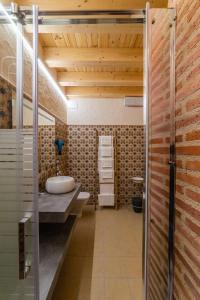 a bathroom with a tub and a sink in a room at El Jaraiz de Don Marciano 