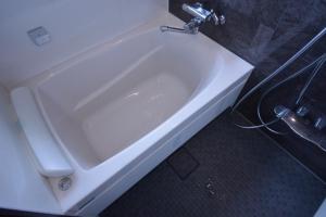 a white bath tub in a bathroom at Daigo - Vacation STAY 04186v in Kanayama