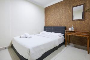Postel nebo postele na pokoji v ubytování Fast Hotel Setapak Near Tunku Abdul Rahman UMT KL