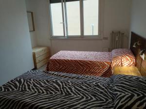 Katil atau katil-katil dalam bilik di Appartamento di Olga
