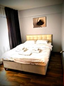 a bedroom with a large bed with white sheets at Taksim Merkez in Istanbul