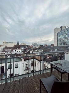 a balcony with a view of a city at Hotel Innception in Cologne