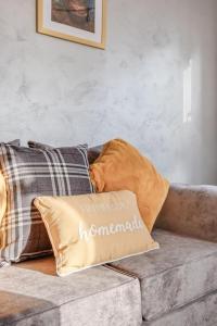 a pillow sitting on top of a couch at Cosy countryside apartment in Wellingborough