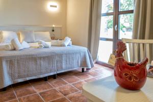 Letto o letti in una camera di Alghero Resort Country Hotel & Spa