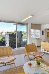 a living room with two chairs and a table at Apartment La Maresia CB9A by VillaGranCanaria in San Agustin