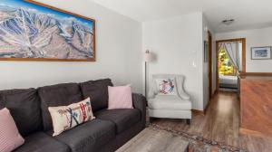 a living room with a couch and a chair at 57 North Lynx Condo Condo in Warren +30 photos